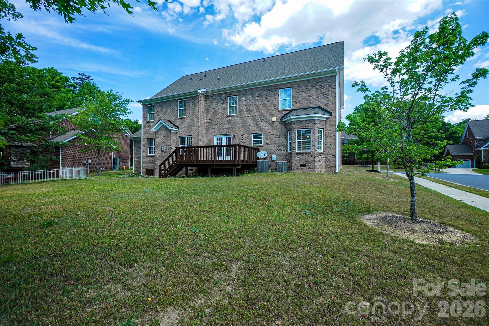 4008 Oxford Mill Road Waxhaw, NC 28173 - Photo 2 of 44 a view of a house with a big yard plants and large trees