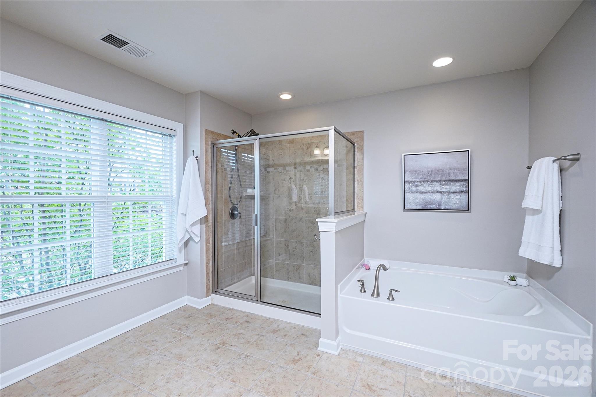 4008 Oxford Mill Road Waxhaw, NC 28173 - Photo 27 of 44 a bathroom with a bathtub and a shower