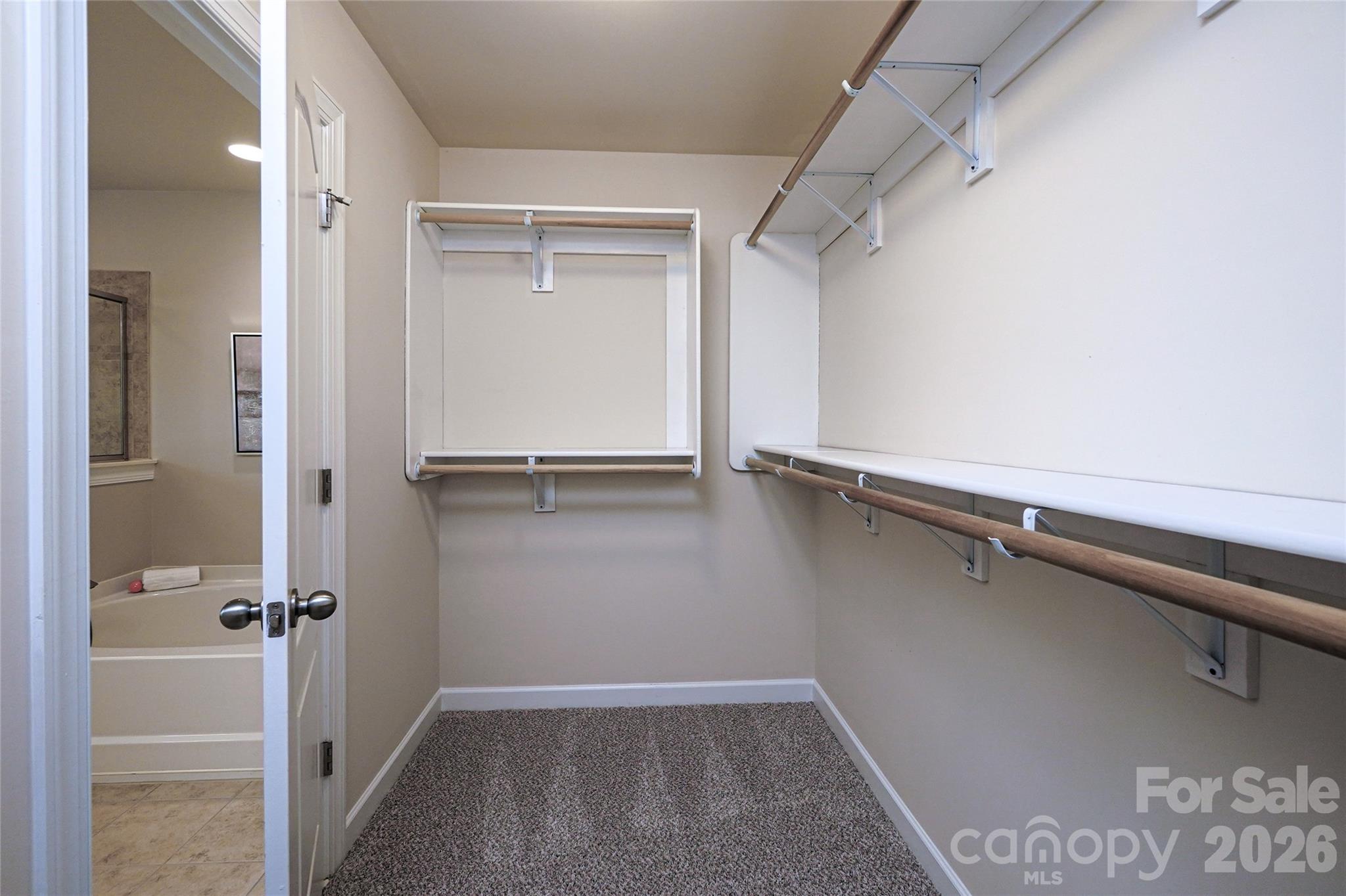 4008 Oxford Mill Road Waxhaw, NC 28173 - Photo 30 of 44 a view of a room with racks on the wall
