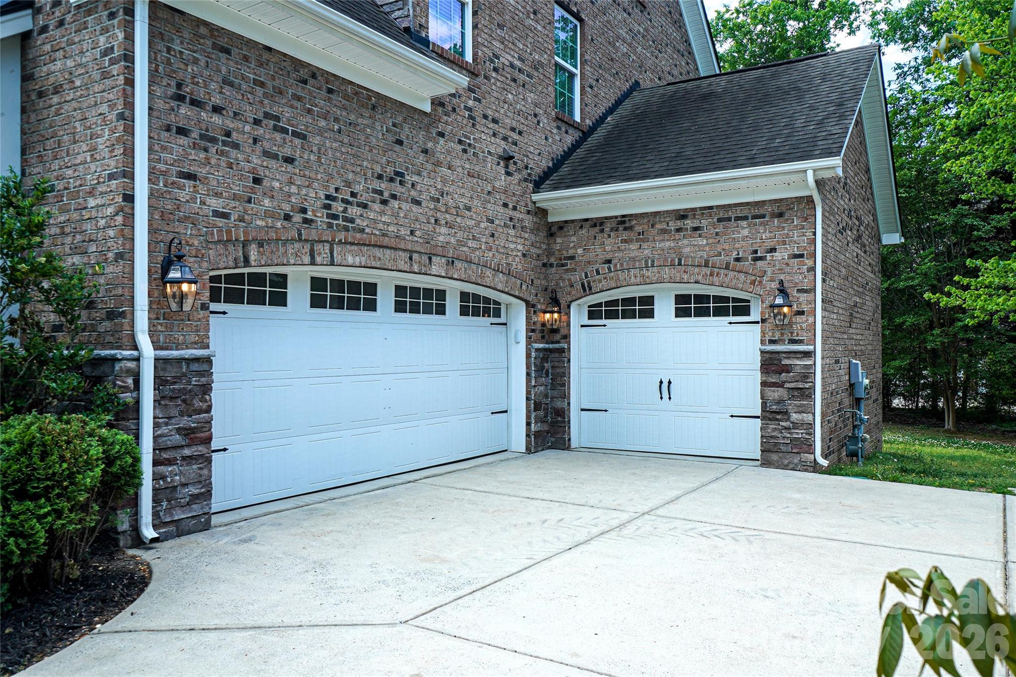 4008 Oxford Mill Road Waxhaw, NC 28173 - Photo 4 of 44 a front view of a house with a garage