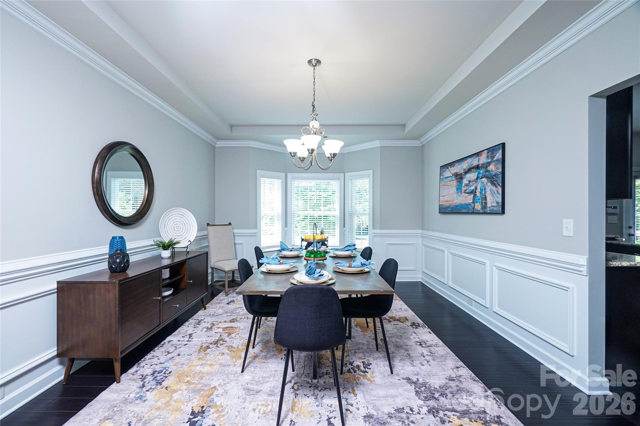 4008 Oxford Mill Road Waxhaw, NC 28173 - Photo 10 of 44 a view of a dining room with furniture and a chandelier
