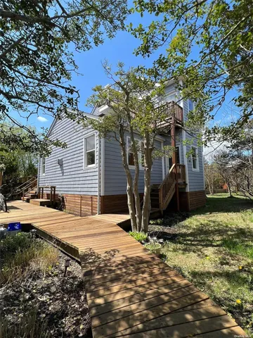 a view of a backyard of the house