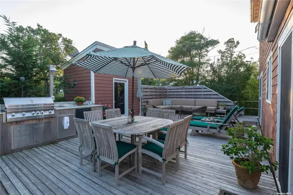 a view of a table and chairs in patio of the house