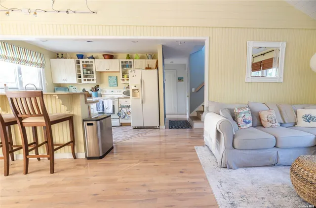 a living room with furniture and a rug