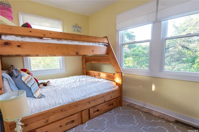 a bed room with a bed and a window