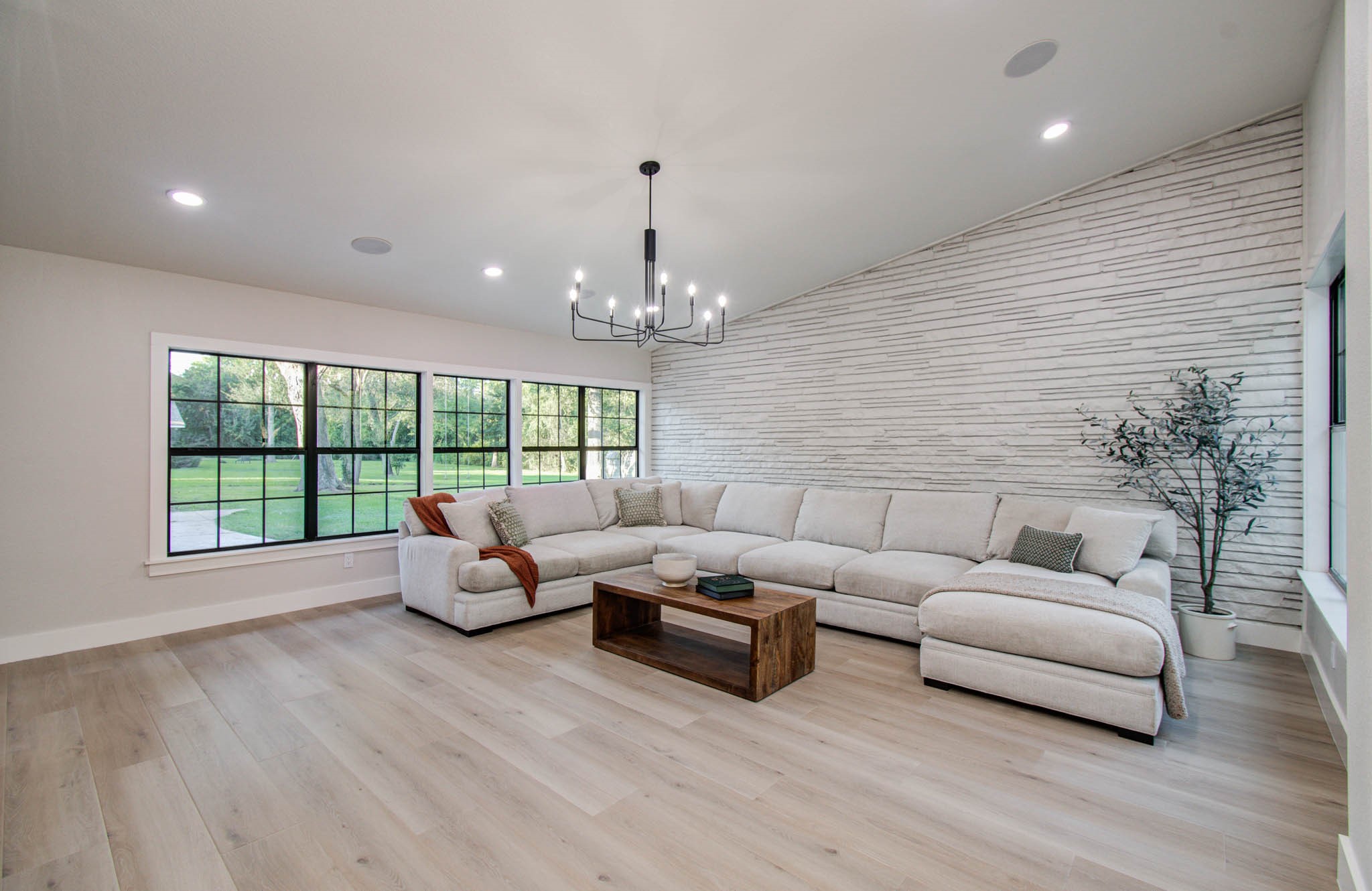 116 Laughlin Road Eagle Lake, TX 77434 - Photo 16 of 41 a living room with furniture and a chandelier
