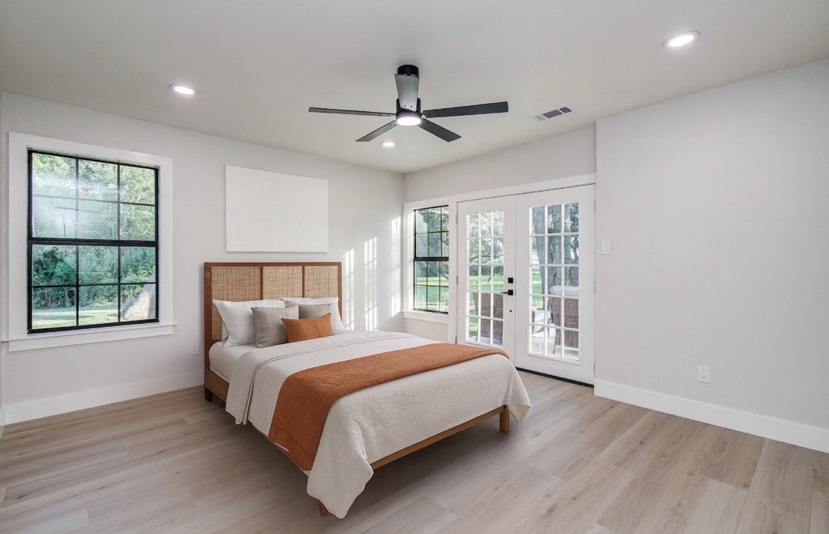 116 Laughlin Road Eagle Lake, TX 77434 - Photo 33 of 41 a bedroom with a large bed and a large window