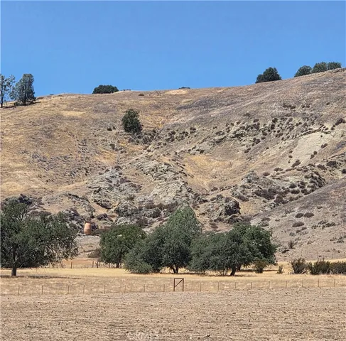 a view of a dry yard covered with snow