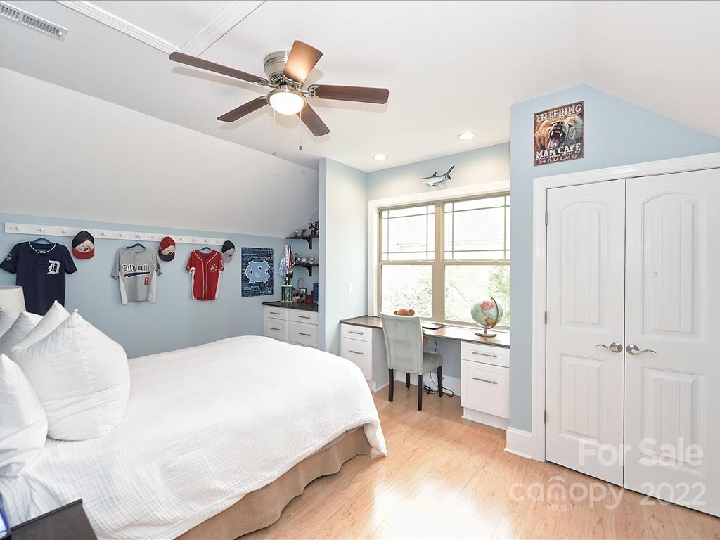 801 Sedgefield Road Charlotte, NC 28209 - Photo 25 of 30 a bed room with a bed and a window