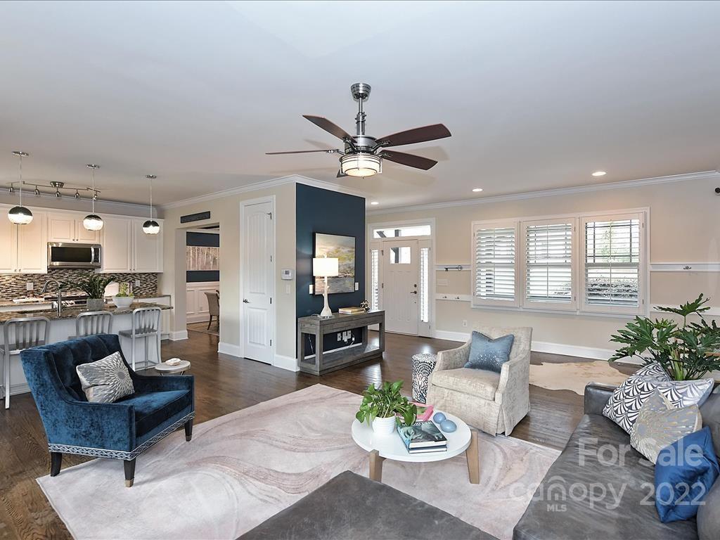 801 Sedgefield Road Charlotte, NC 28209 - Photo 3 of 30 a living room with furniture kitchen view and a large window