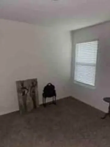 a bedroom with a bed and a mirror