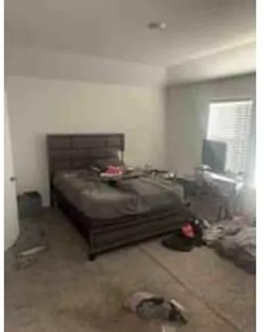 a view of house with backyard