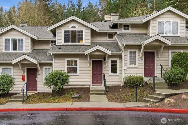 a front view of a house with yard