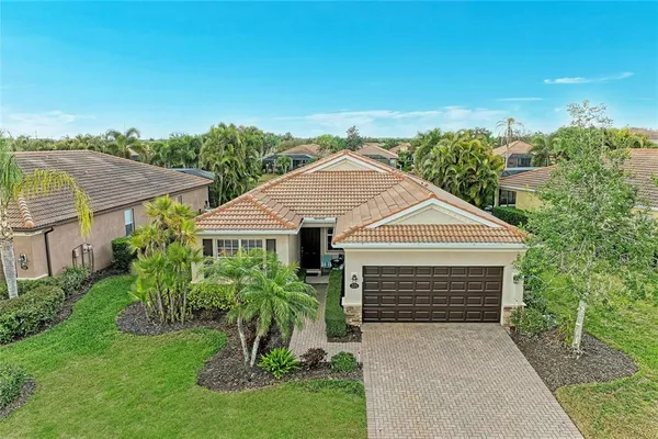 an aerial view of a house with a garden