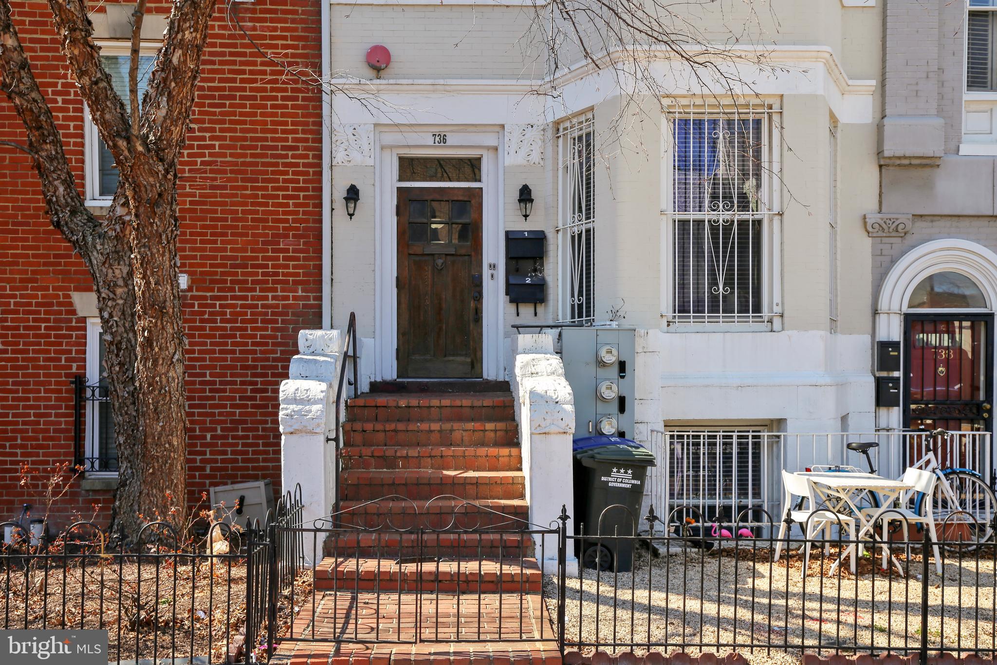 736 11th Street Northeast Washington, DC 20002 - Photo 2 of 43 Fenced front entrance w/pebble landscaped garden