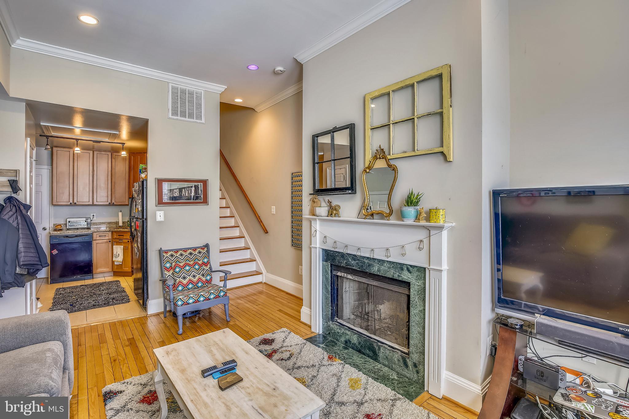 736 11th Street Northeast Washington, DC 20002 - Photo 6 of 43 Unit 1 Living Room w/wood burning fireplace
