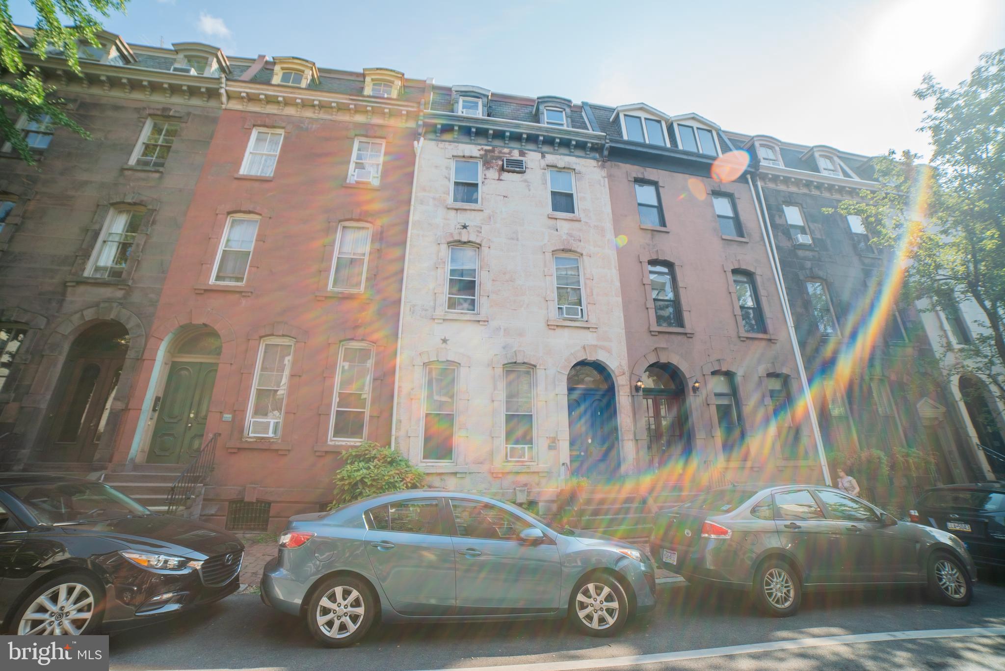 a front view of a house with parking