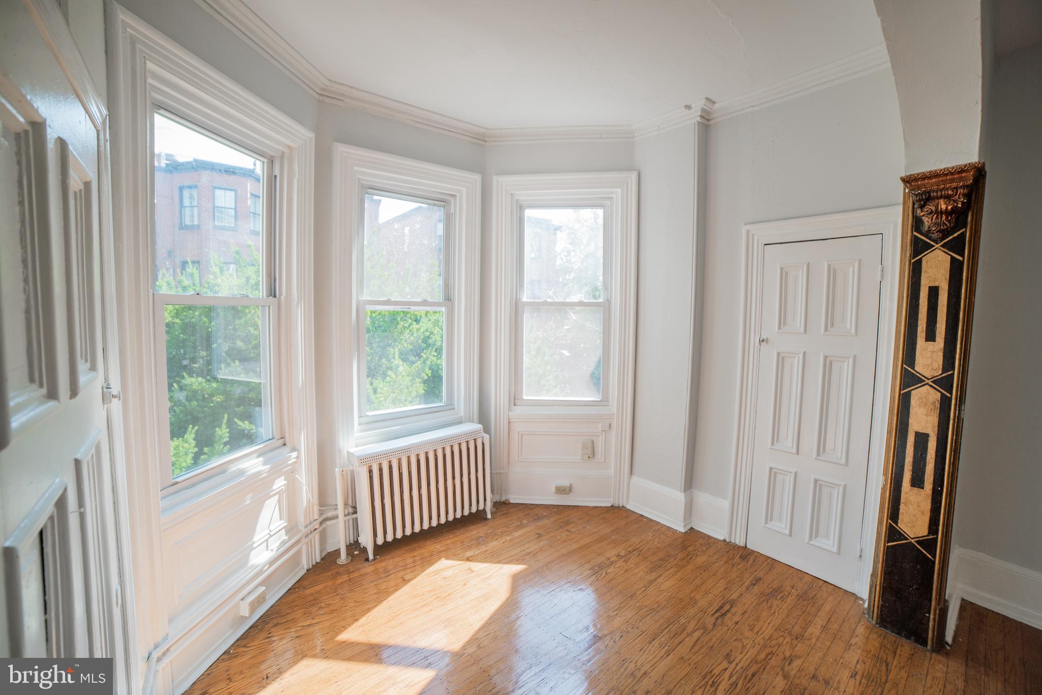 2316 Spruce Street, Unit 2R Philadelphia, PA 19103 - Photo 7 of 11 a view of livingroom with furniture and a window