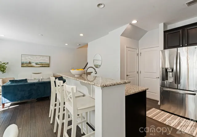 a kitchen with a sink appliances and cabinets