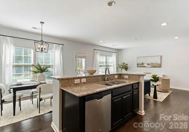 a view of a kitchen counter space dining table and chairs