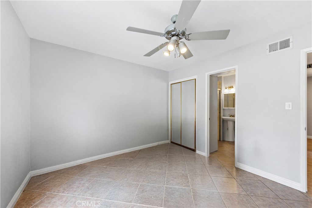 461 West Blaine Street Riverside, CA 92507 - Photo 11 of 22 a view of an empty room with a chandelier fan