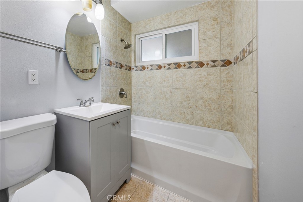 461 West Blaine Street Riverside, CA 92507 - Photo 16 of 22 a bathroom with a sink toilet and shower