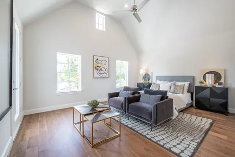 a living room with furniture rug and window