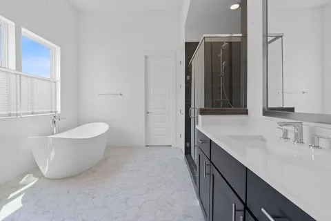 a bathroom with a bathtub and a sink