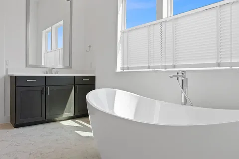a white bath tub sitting in a bathroom