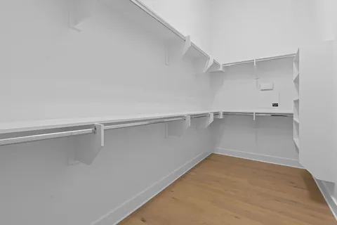 a view of an empty walk in closet
