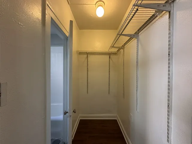 a bathroom with a sink mirror and toilet