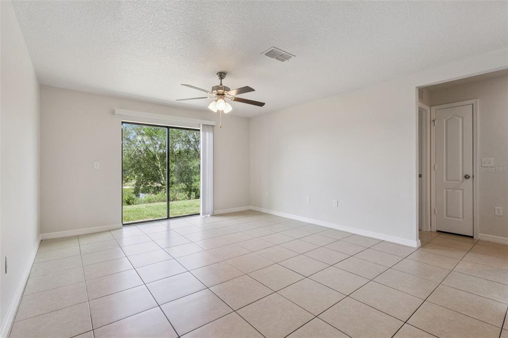 1613 Orne Street Mascotte, FL 34753 - Photo 8 of 31 a view of an empty room with a window
