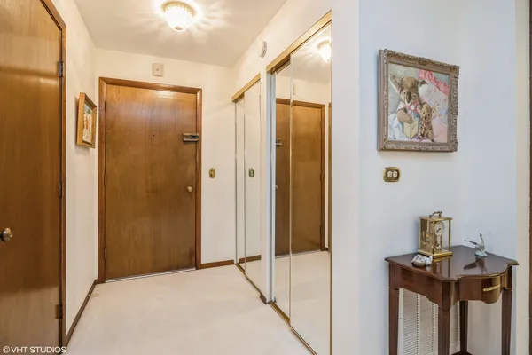 a view of a hallway with paintings on the wall