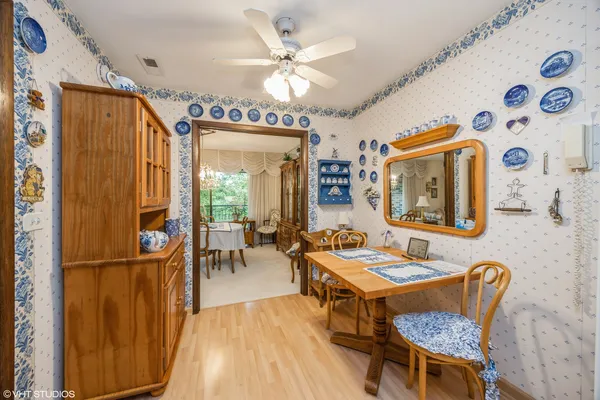 a dining room with furniture and window
