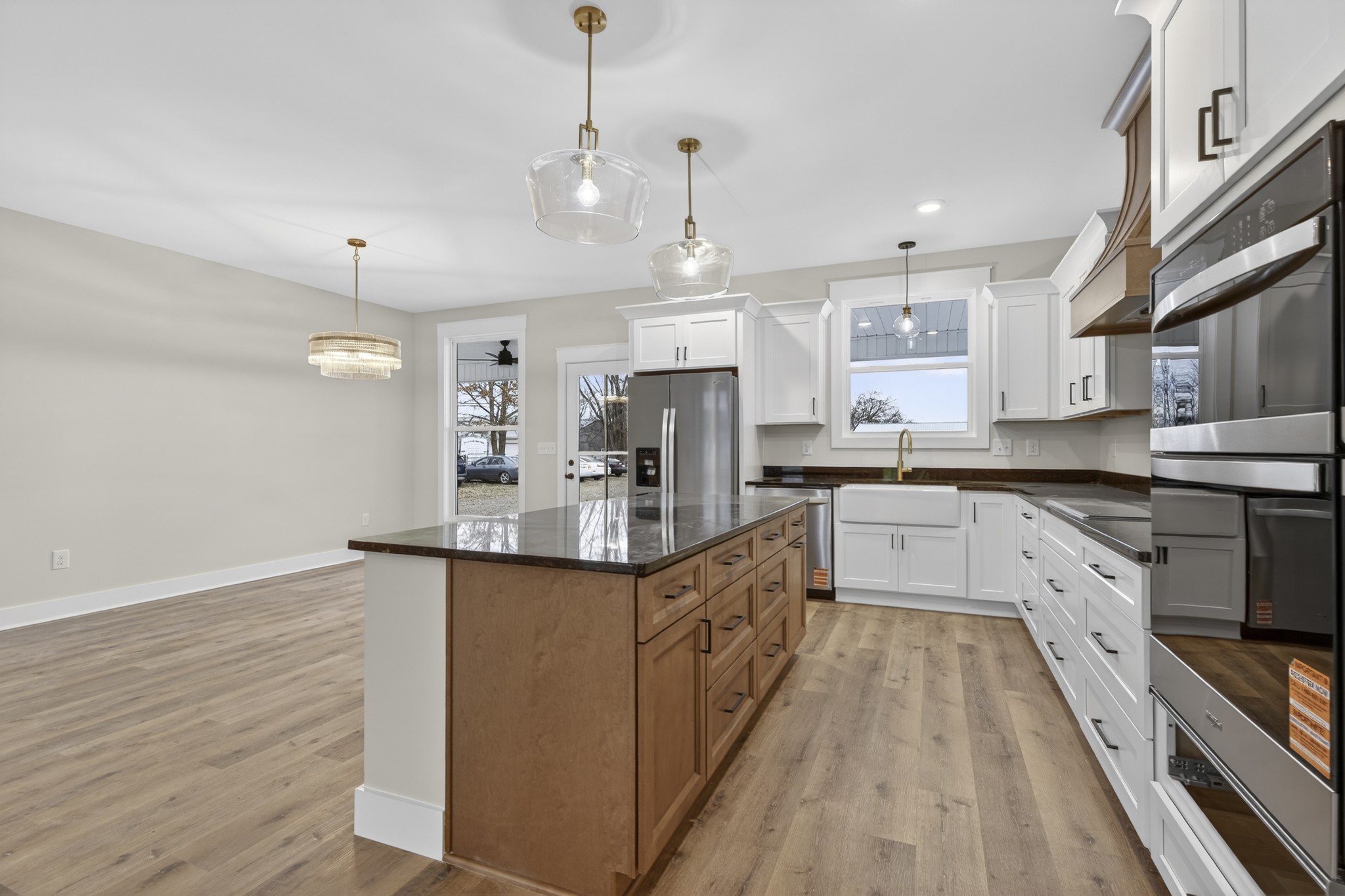 777 Rock Springs Road Castalian Springs, TN 37031 - Photo 13 of 56 a large kitchen with stainless steel appliances granite countertop a lot of counter space and wooden floor