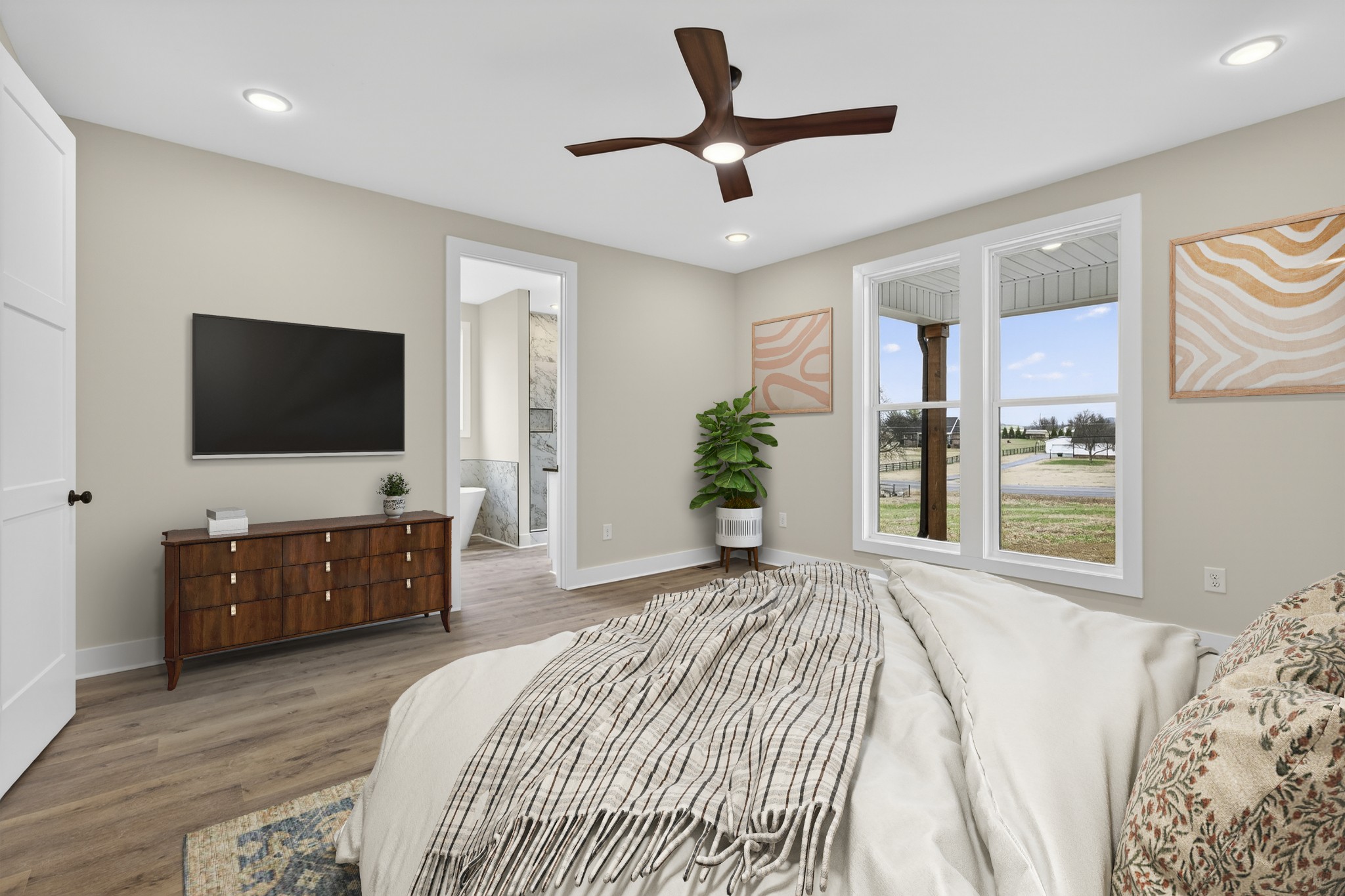 777 Rock Springs Road Castalian Springs, TN 37031 - Photo 19 of 56 a bedroom with a bed and a flat screen tv on dresser