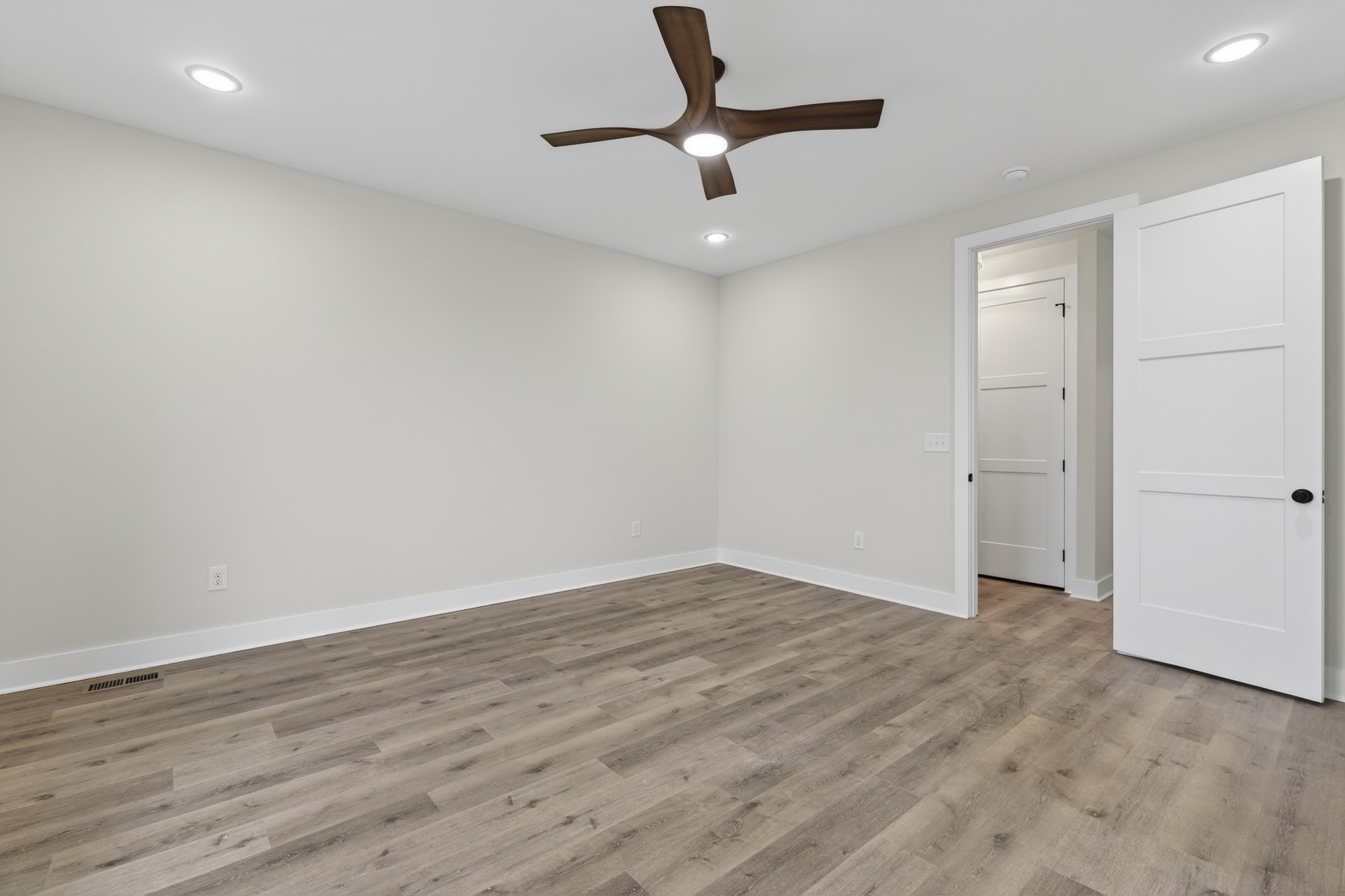 777 Rock Springs Road Castalian Springs, TN 37031 - Photo 20 of 56 a view of an empty room with wooden floor