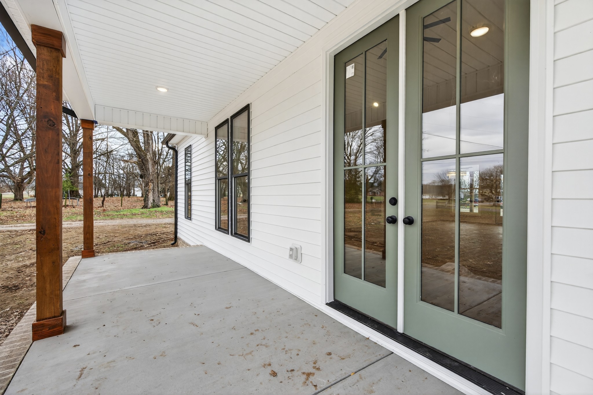 777 Rock Springs Road Castalian Springs, TN 37031 - Photo 42 of 56 a view of a hallway with wooden floor and glass door