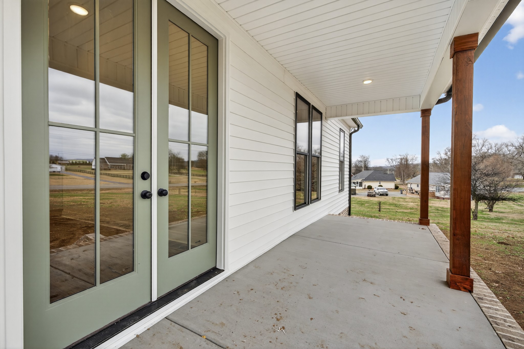 777 Rock Springs Road Castalian Springs, TN 37031 - Photo 43 of 56 a view of a room with a floor to ceiling window and an outdoor kitchen