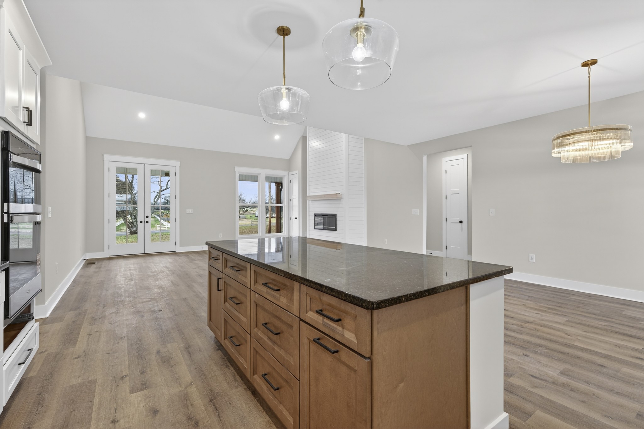 777 Rock Springs Road Castalian Springs, TN 37031 - Photo 9 of 56 a kitchen with kitchen island granite countertop a stove and a wooden floors