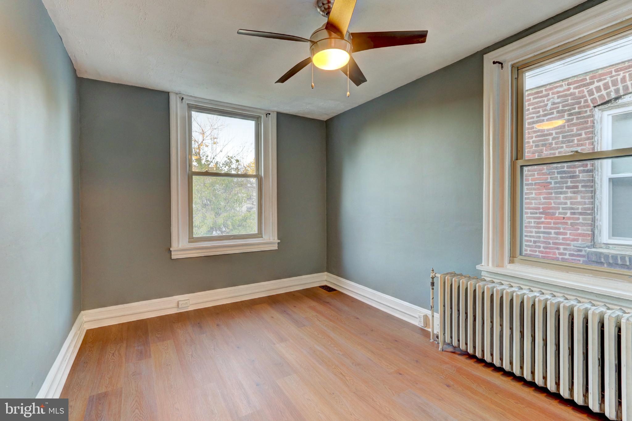 112 Vassar Street Philadelphia, PA 19128 - Photo 20 of 33 a view of empty room with wooden floor and fan