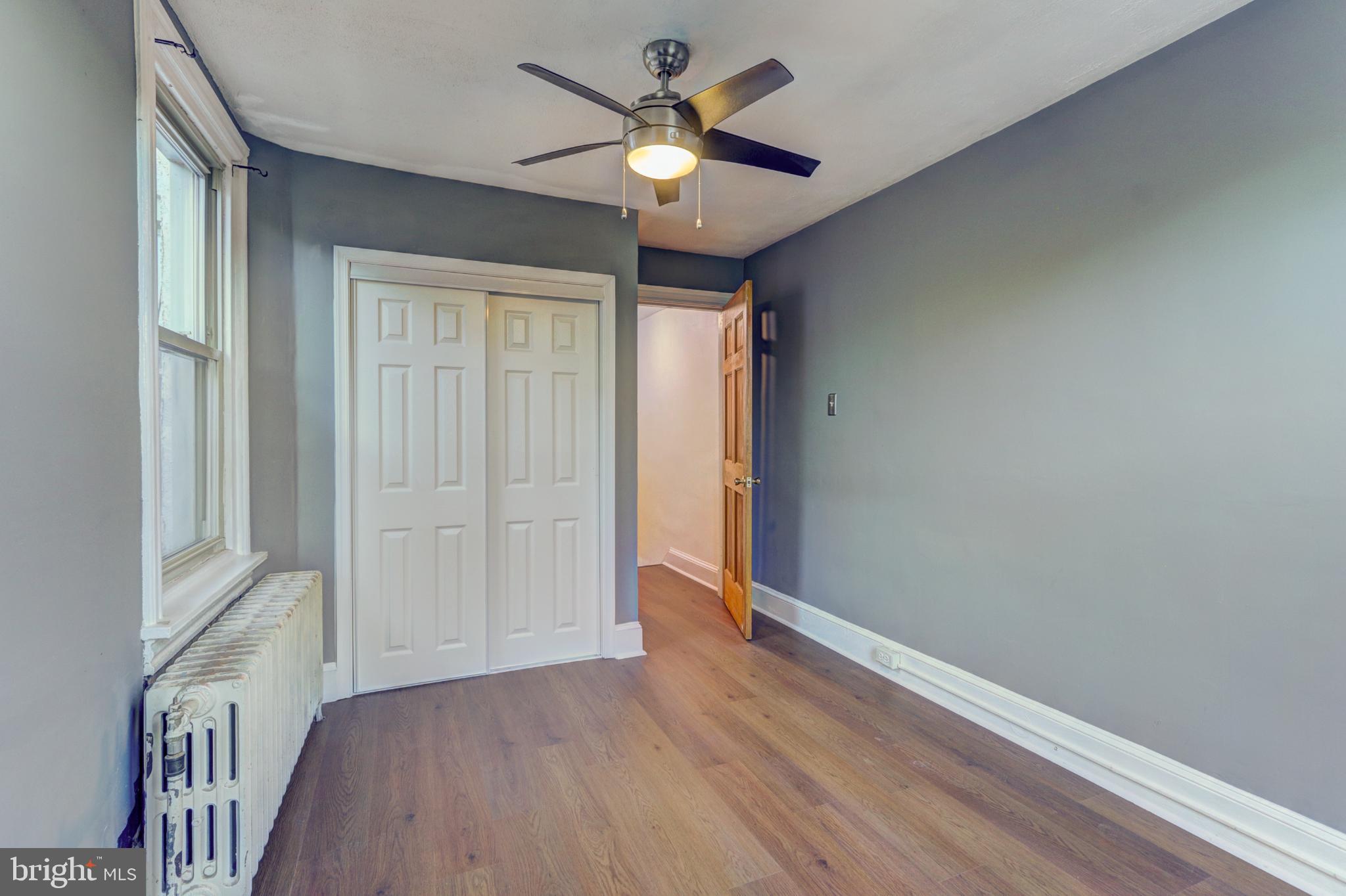 112 Vassar Street Philadelphia, PA 19128 - Photo 21 of 33 wooden floor in an empty room with a window