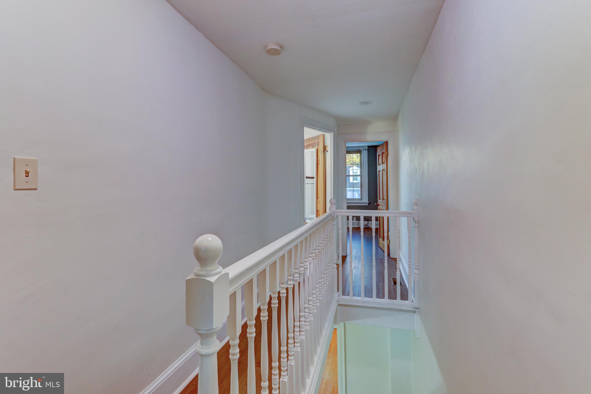 112 Vassar Street Philadelphia, PA 19128 - Photo 22 of 33 a view of a hallway with wooden floor and entryway
