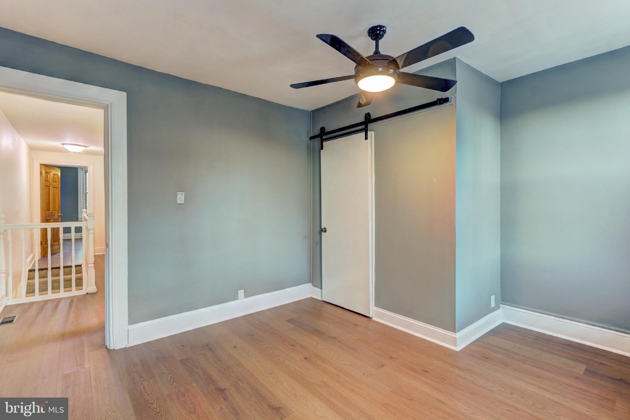 112 Vassar Street Philadelphia, PA 19128 - Photo 27 of 33 a view of an empty room with wooden floor