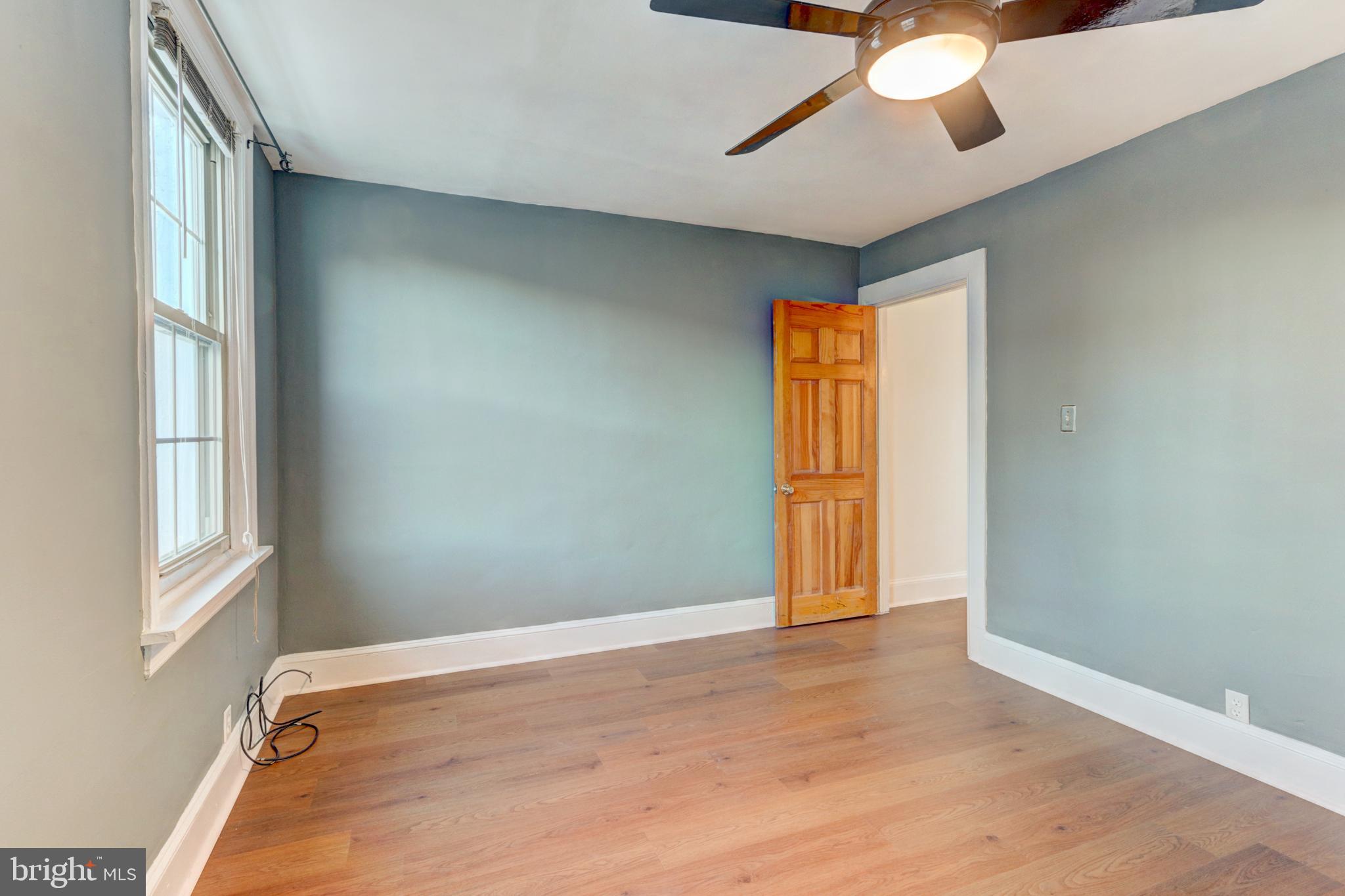 112 Vassar Street Philadelphia, PA 19128 - Photo 28 of 33 a view of an empty room with window and chandelier fan