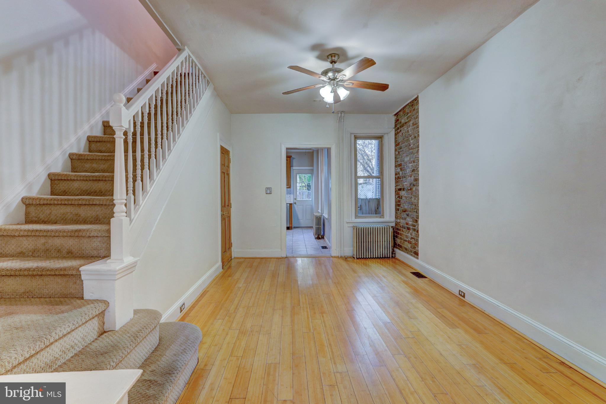 112 Vassar Street Philadelphia, PA 19128 - Photo 8 of 33 a view of an empty room with wooden floor and staircase
