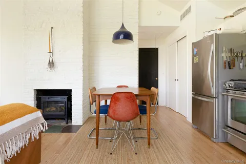 a dining room with furniture and a fireplace