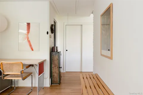 a view of hallway with wooden floor