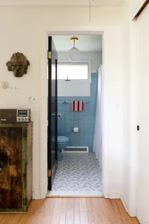 a bathroom with a shower and a toilet