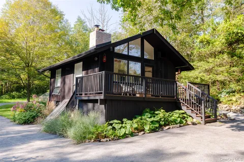 a view of balcony with wooden floor